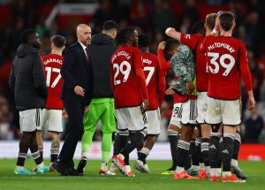 Manchester United players with manager Erik ten Hag